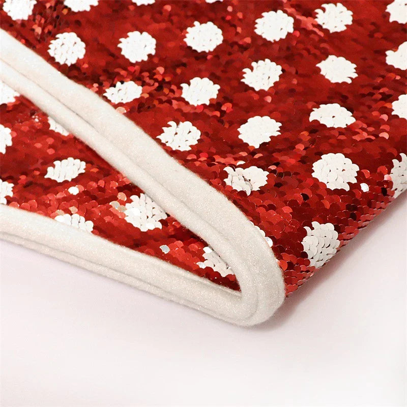 Festive Christmas tree skirt with red and white polka dot pattern and shimmering sequins