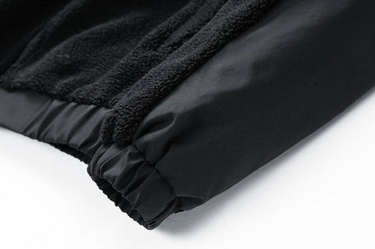 A cozy and stylish men's fleece jacket with a standing collar and convenient side pockets, available in a range of classic colors.