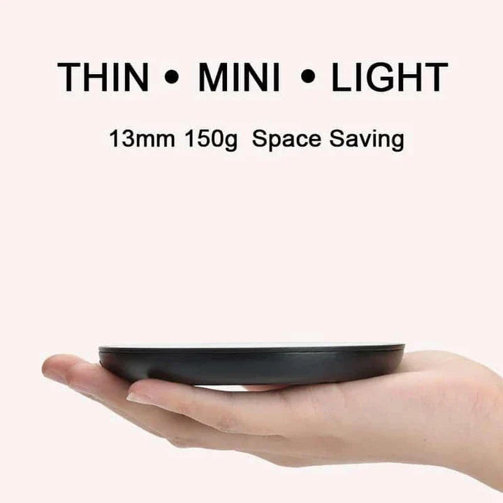 A modern and compact coffee cup warmer with an automatic shut-off feature for energy efficiency and temperature control.