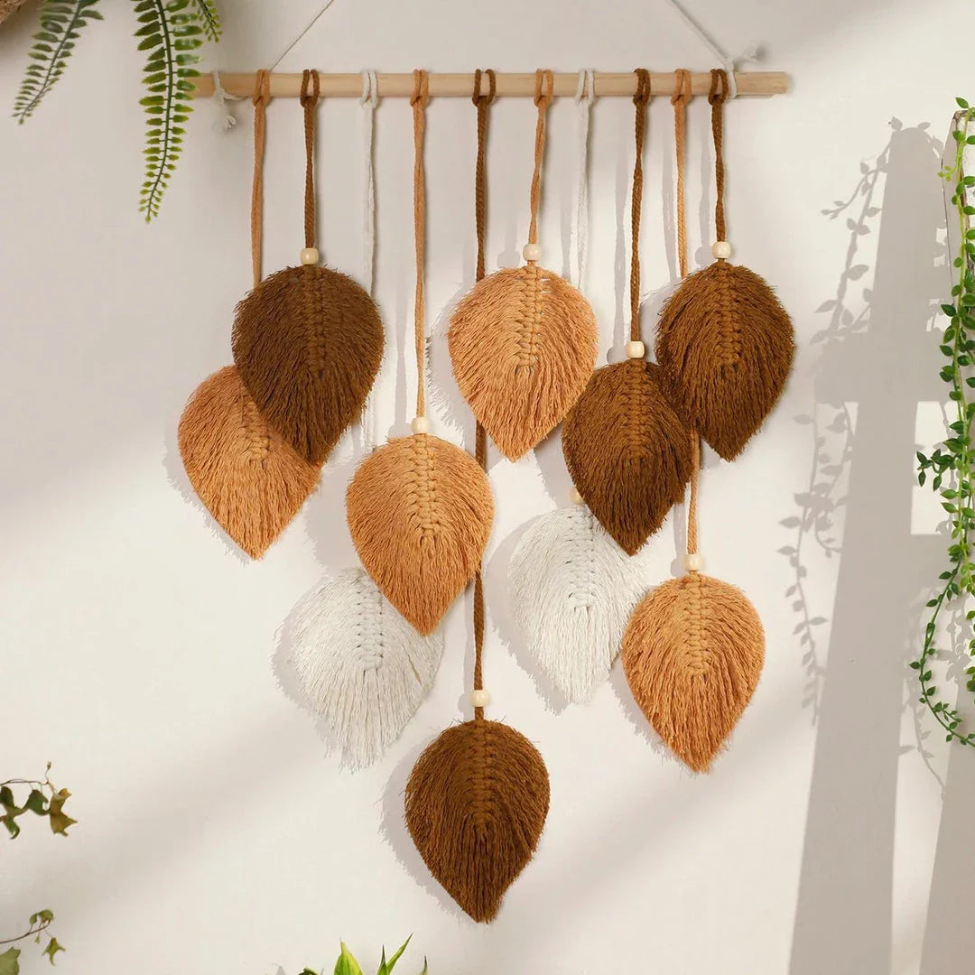 Boho macrame leaf tapestry in earthy tones, featuring elegant leaves and flowing tassels for a cozy, nature-inspired decor piece