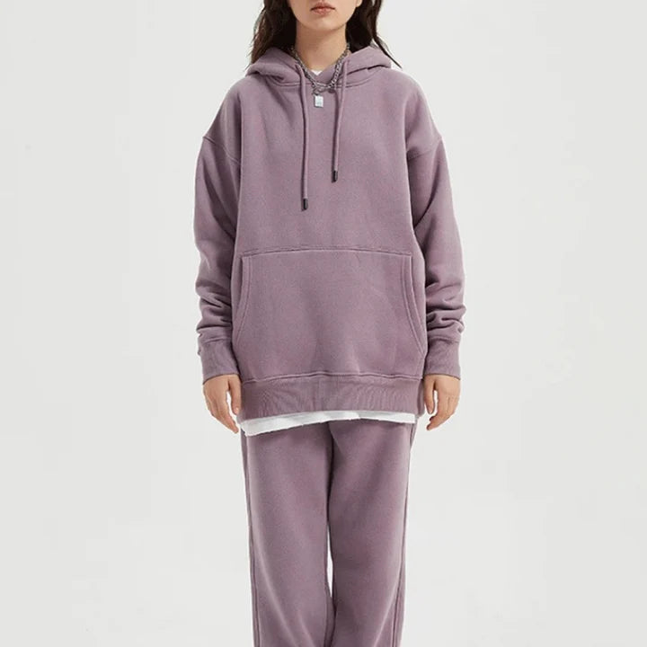 Cozy Fleece Hoodie and Sweatpants Set in Light Pink, featuring a relaxed fit and hooded design for maximum comfort and style.
