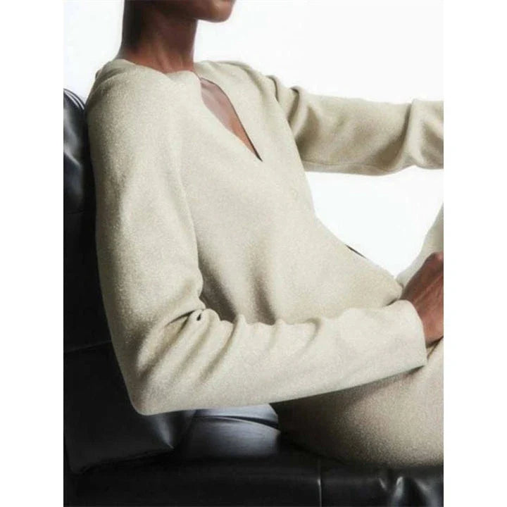 A cozy and chic v-neck cardigan in a classic solid color, featuring a slim, flattering fit and elegant button detailing for versatile autumn and winter wear.