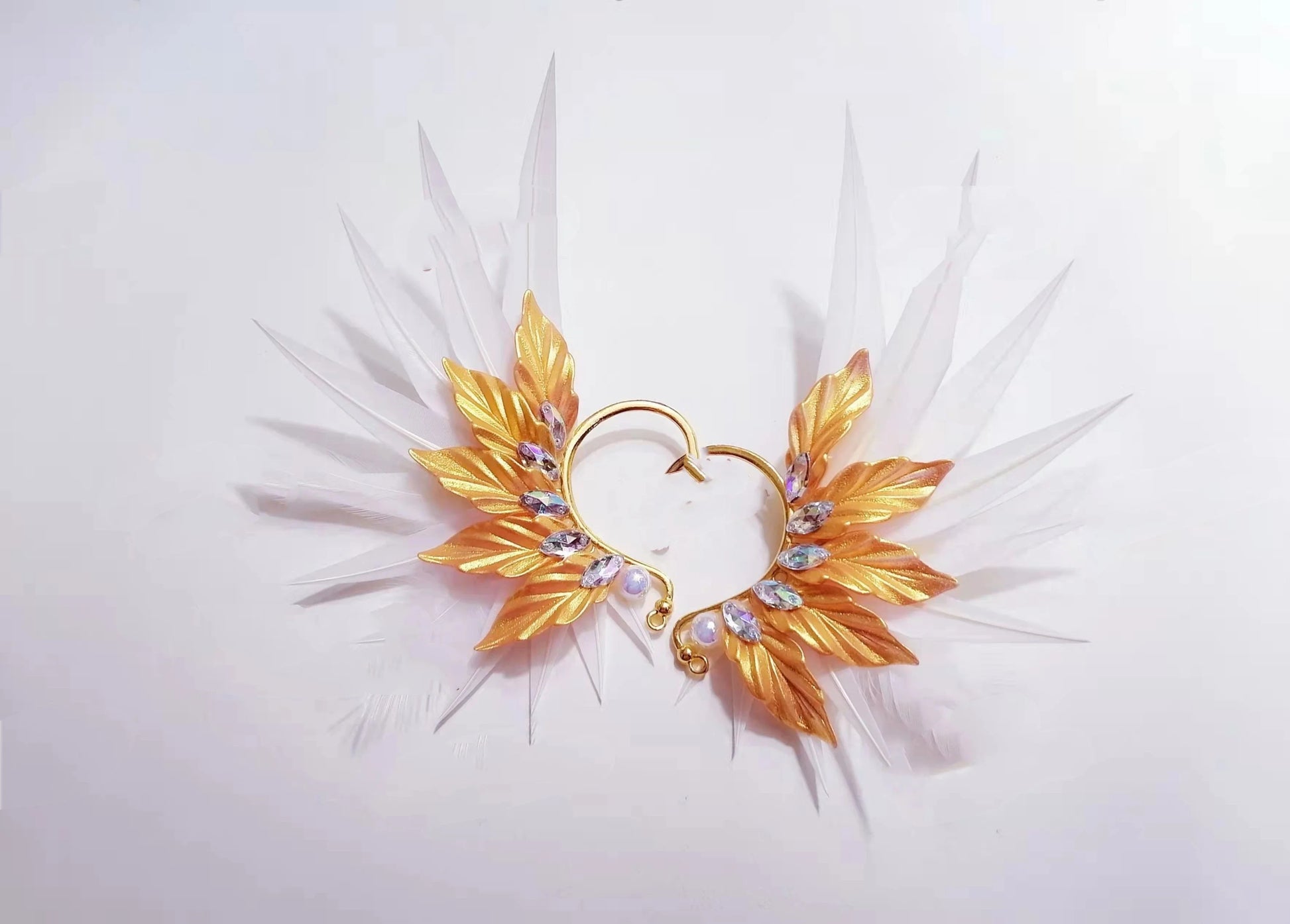 Elegant feather earrings with delicate angel wing design in various color options