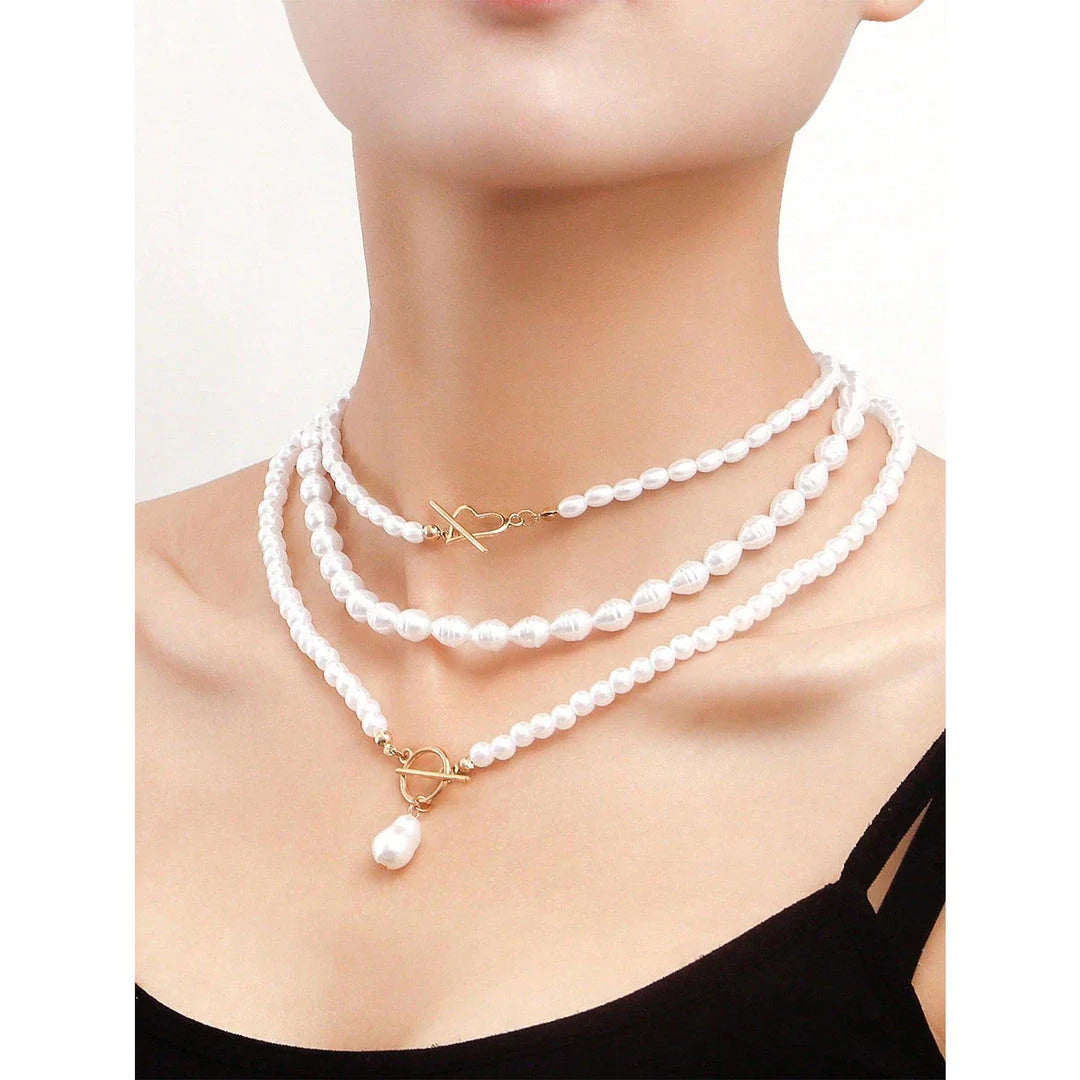 Elegant imitation pearl heart pendant necklace with lustrous bead chain and secure closure