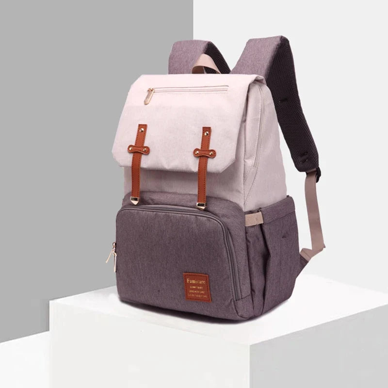 Premium diaper backpack with insulated pockets, stroller attachment, and USB charging port
