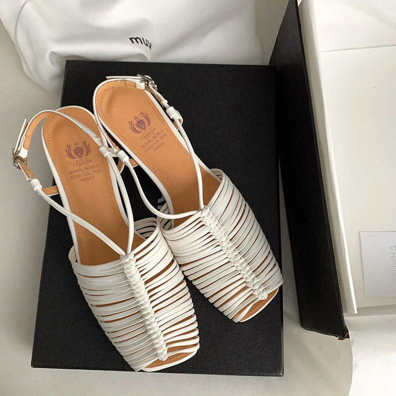 Stylish high heel genuine leather sandals in silver color with ankle strap and fashionable buckle closure