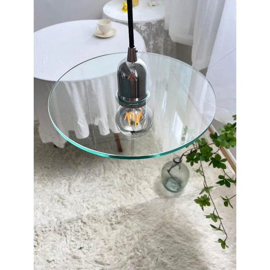 Elegant modern clear glass pendant light with a white shade, perfect for dining rooms and bedrooms