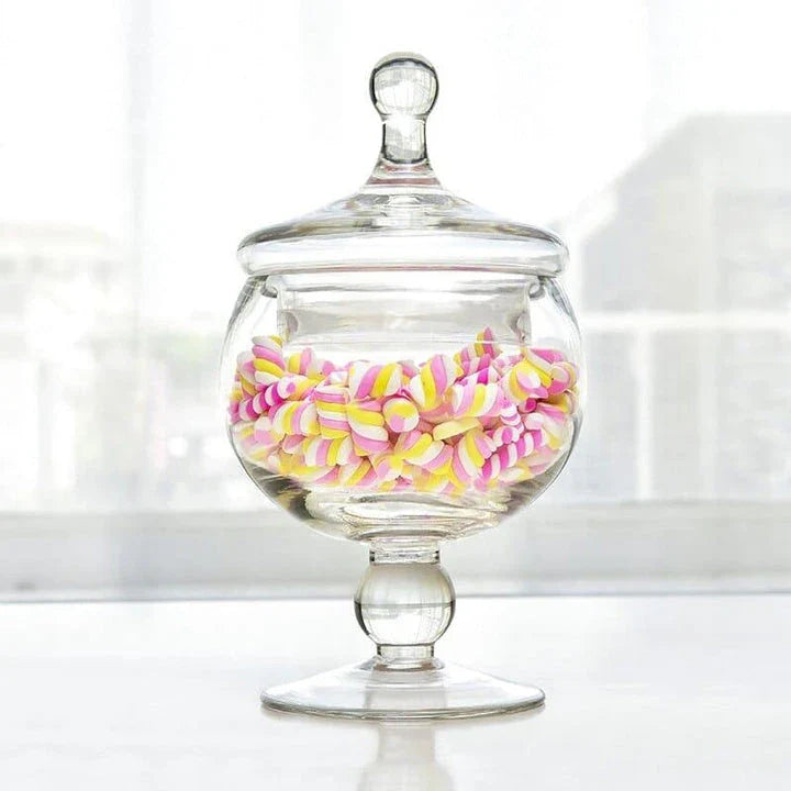 A transparent glass candy jar with an airtight lid, suitable for weddings, parties, and home decor