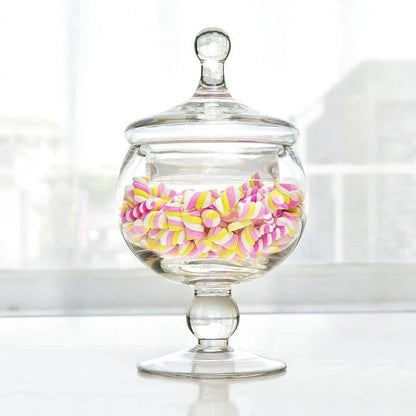 A transparent glass candy jar with an airtight lid, suitable for weddings, parties, and home decor