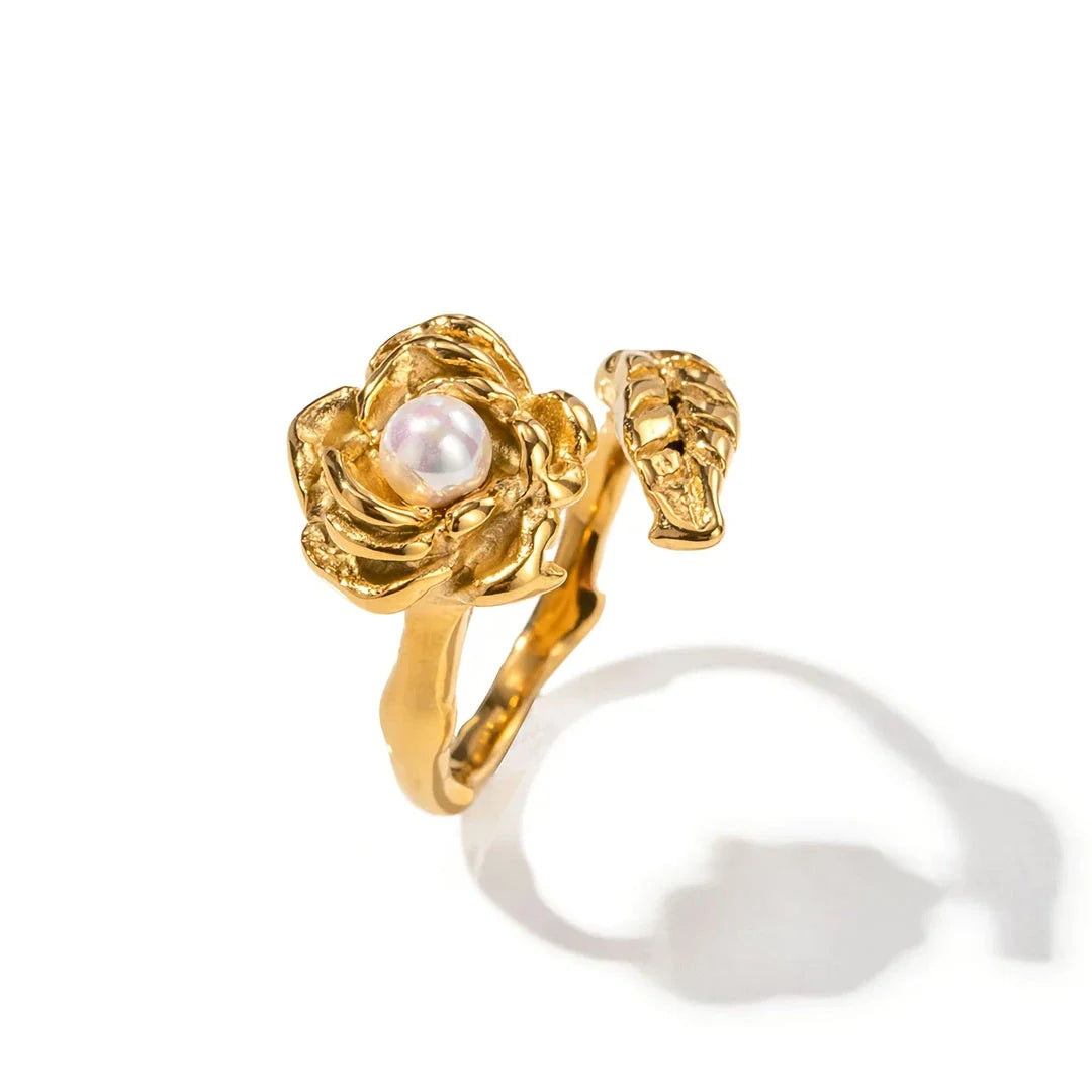 Gold stainless steel camellia ring with shellfish beads, a timeless and elegant accessory for any occasion.