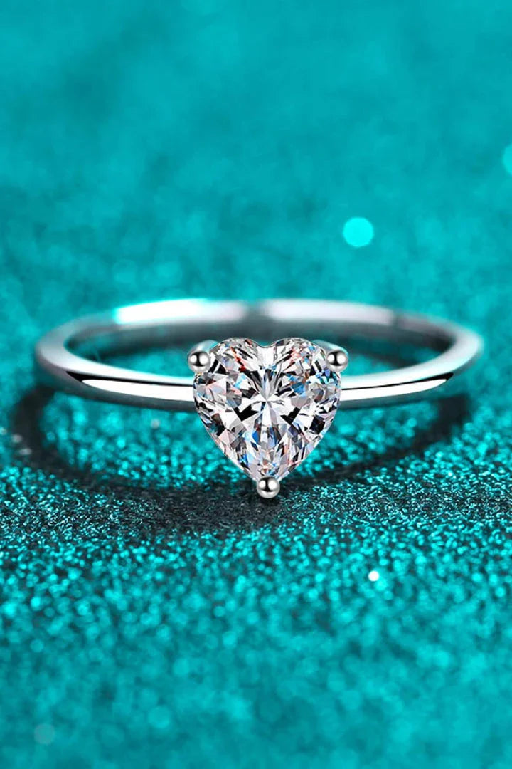 Elegant heart-shaped moissanite solitaire ring in 925 sterling silver with a sleek, modern design