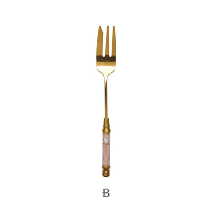 Elegant gold-plated dessert fork with intricate ceramic handle design