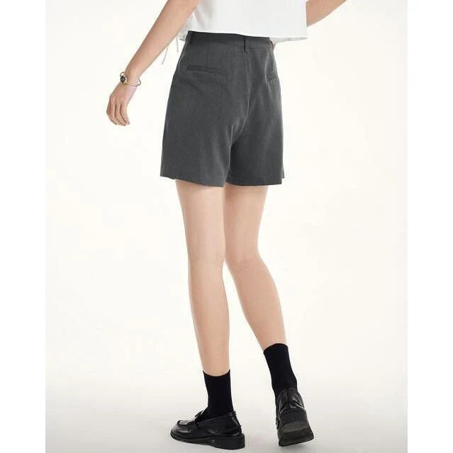 Elegant summer harem shorts for women with high-waist, loose fit, and subtle pleating detail