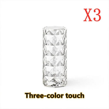 Elegant diamond-inspired crystal lamp with touch-sensitive dimming controls, providing adjustable ambient lighting for bedrooms and living spaces.