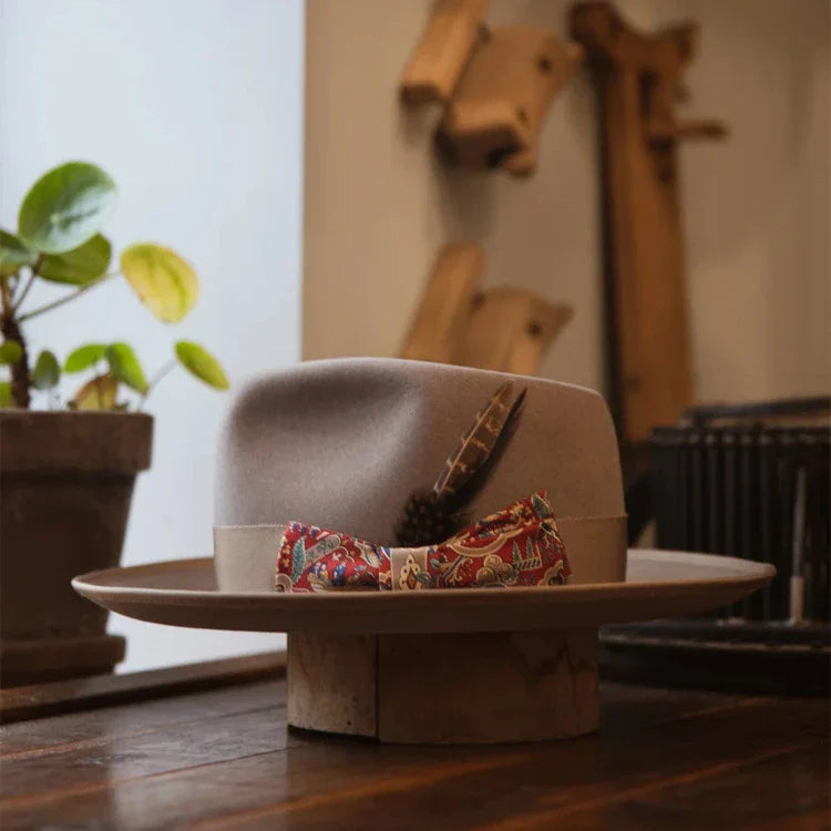 A stylish wool top hat with a conical crown design, providing sun protection and a touch of European elegance.