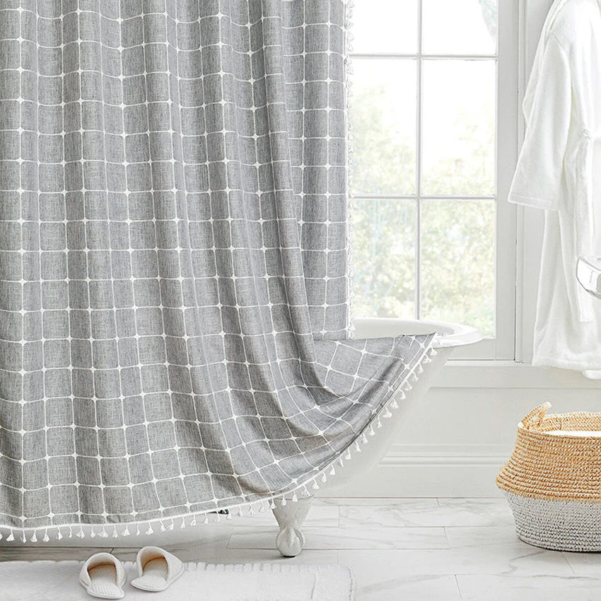 Elegant jacquard linen shower curtain with charming tassels in light grey color, adding sophisticated style to any bathroom