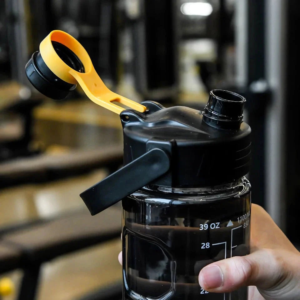 A large capacity sports water bottle with a straw lid and time stamps, designed for ultimate hydration and convenience.