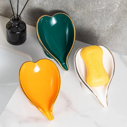 Elegant ceramic leaf-shaped soap dish with a heart design, perfect for adding a touch of nature-inspired luxury to your bathroom decor
