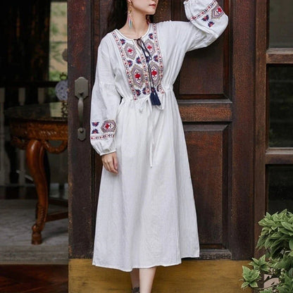Elegant embroidered cotton-linen dress with tassels, featuring a waist-cinching A-line silhouette in vibrant colors