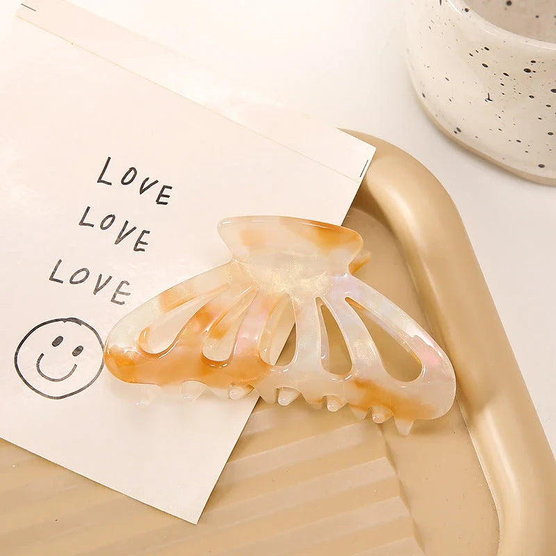 Stylish geometric hollow stripes barrettes in beige color, a fashionable hair accessory for women and girls