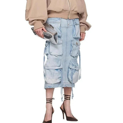A high-waisted denim skirt with a distressed ribbon slit, perfect for adding a touch of fashionable flair to your spring wardrobe.