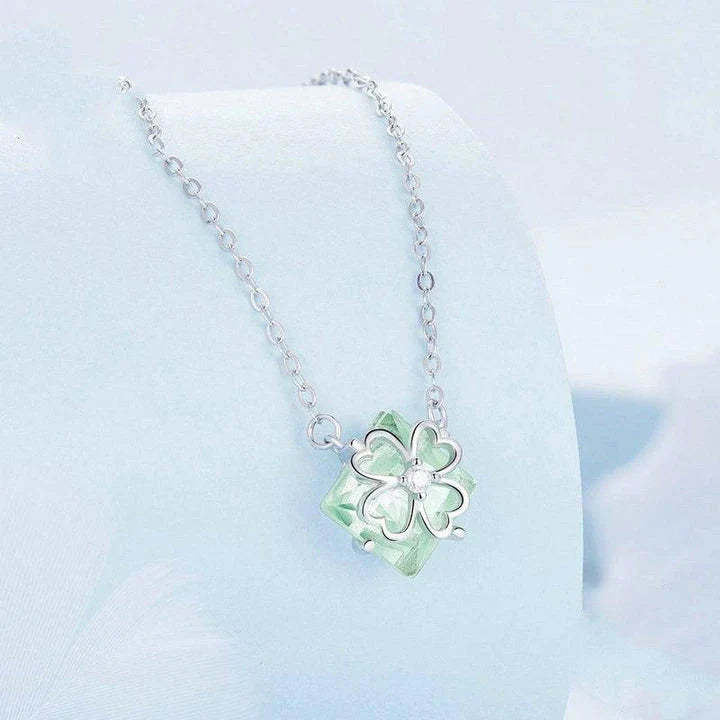 Elegant platinum-plated adjustable green pendant necklace with a sleek, silver-toned chain and a stylish green pendant