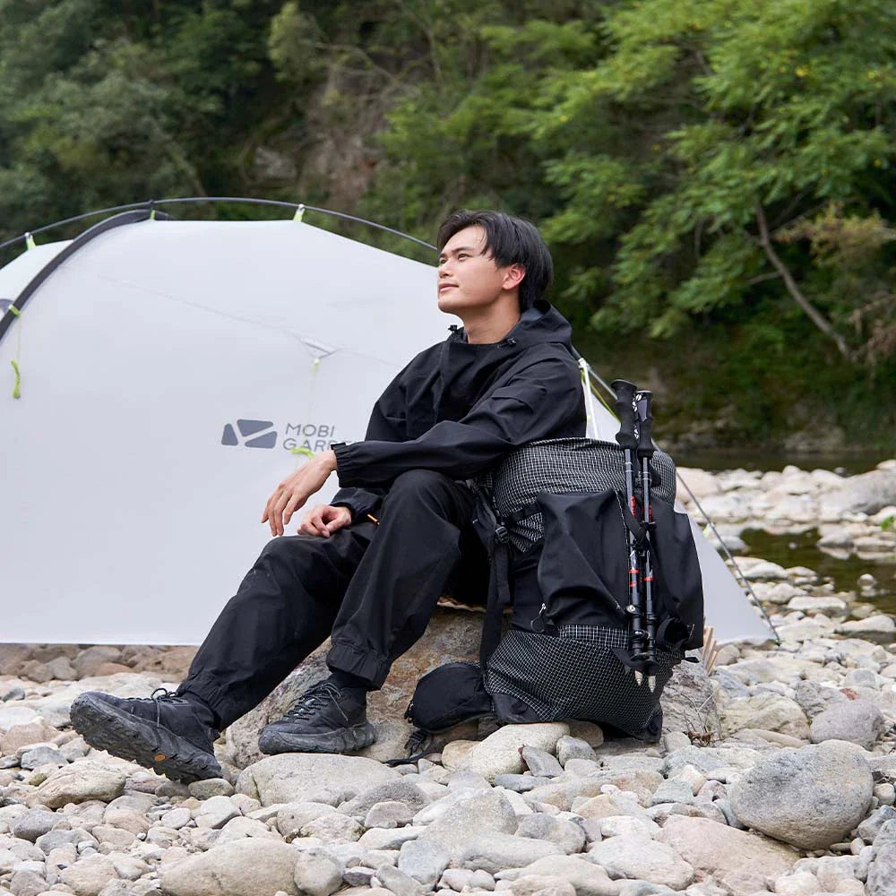 Durable Mountaineering Backpack with 48-liter main compartment, abrasion-resistant 420D Nylon construction, and adjustable features for comfortable outdoor adventures