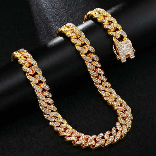 Elegant gold-colored Cuban chain necklace with rhinestone embellishments, perfect for everyday wear and style enhancement.