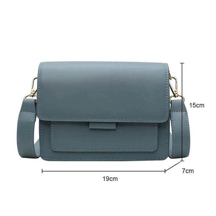 Stylish black crossbody shoulder bag with adjustable strap and multiple interior compartments for modern women