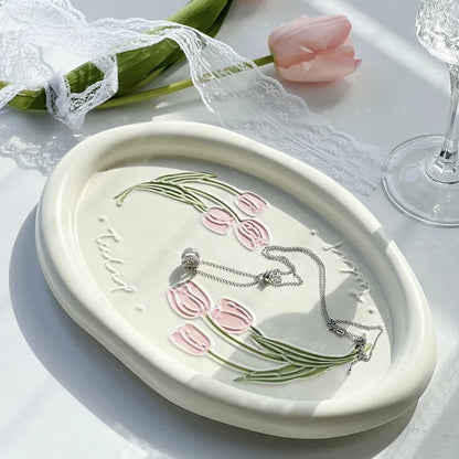 Elegant ceramic plate with French-inspired Calla Tulip floral relief pattern, perfect for formal and casual dining settings