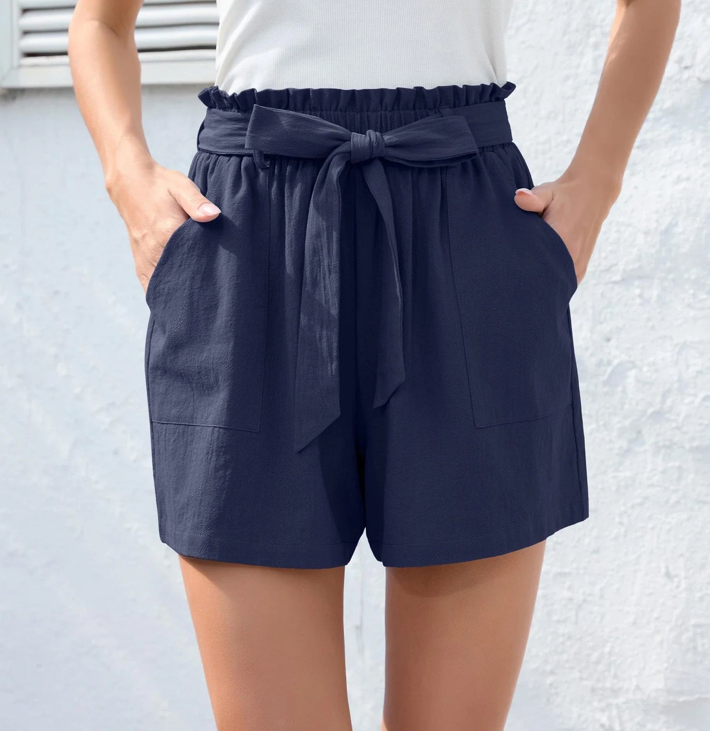 Ruffle bow waist tie shorts in black, made of lightweight and breathable polyester fabric, with convenient pockets for storage