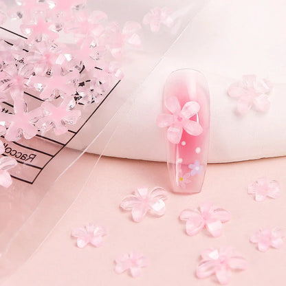 Transparent jelly 3D flower nail charms with rhinestone accents for elegant and charming nail art designs