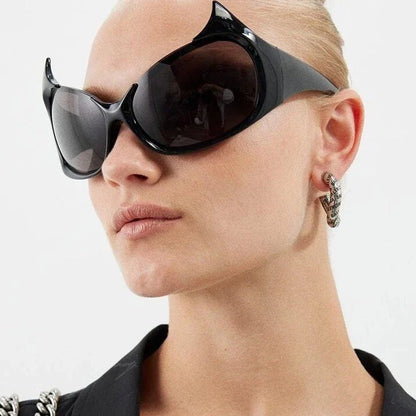 Stylish cat-eye sunglasses with oversized frames, semi-rimless design, and punk-inspired detailing for a timeless, glamorous look