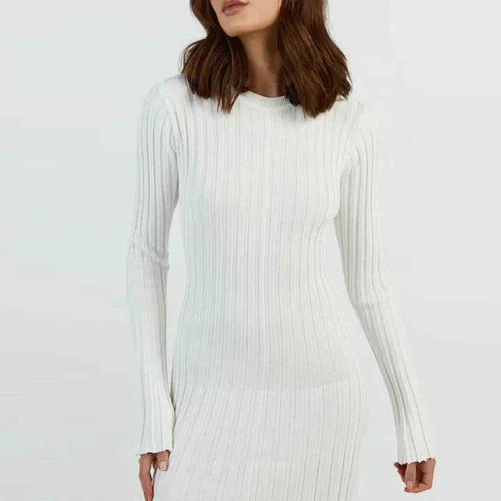 Timeless elegant pleated knit dress in black, perfect for summer office wear with a sophisticated and comfortable design.