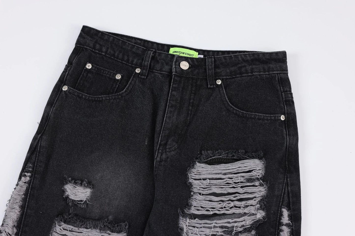 Premium loose fit distressed denim trousers for men and women, featuring a relaxed silhouette, high-quality cotton construction, and trendy distressed details.
