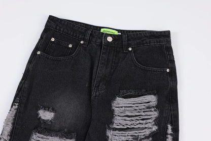 Premium loose fit distressed denim trousers for men and women, featuring a relaxed silhouette, high-quality cotton construction, and trendy distressed details.