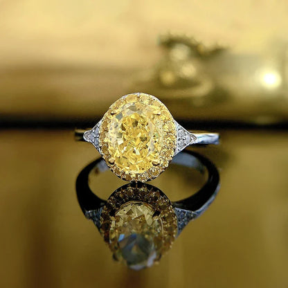 Elegant yellow diamond cocktail ring with a sleek, silver-toned band and a regal crown-shaped setting