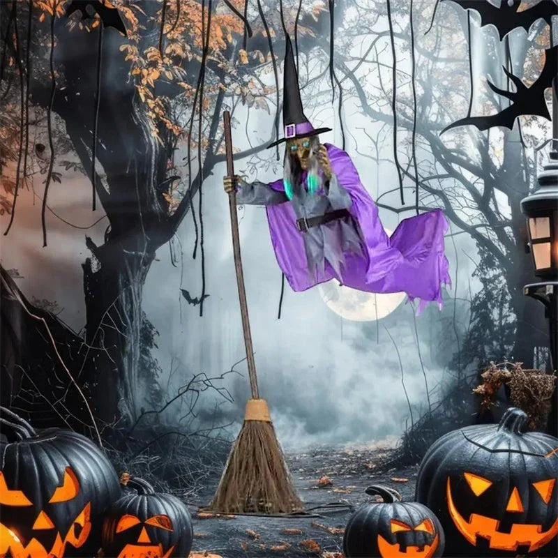 Floating Halloween witch decoration with broom, lifelike facial features, and flowing purple skirt for spooky outdoor display