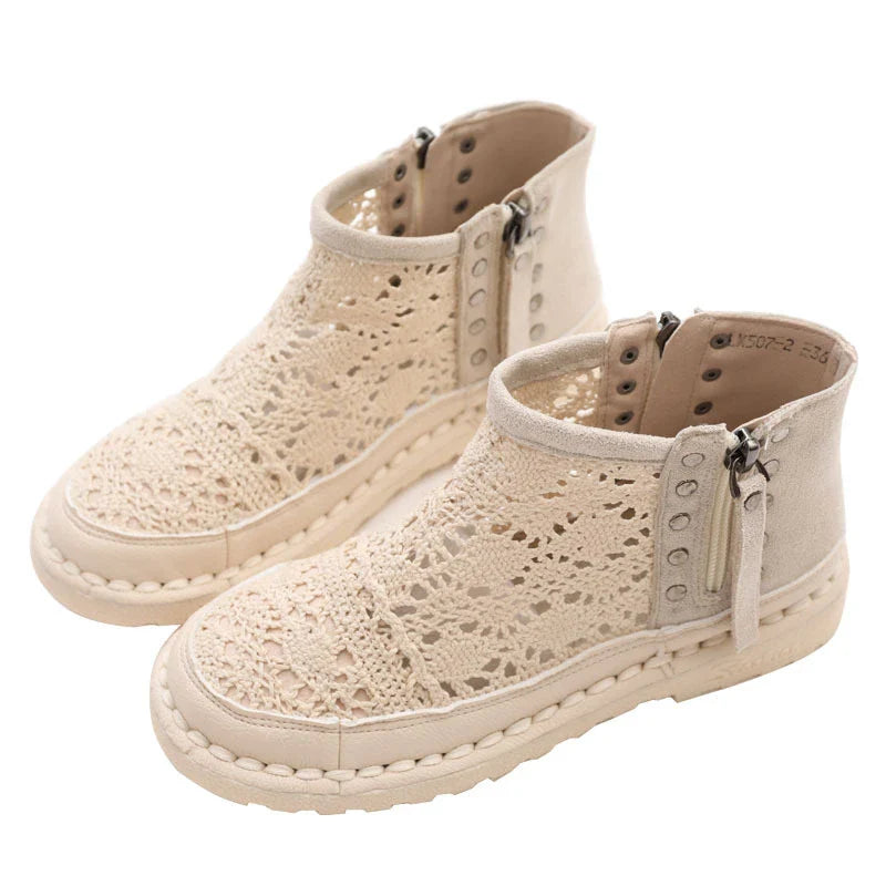 Flat-soled women's Martin boots in grey and beige colors, featuring a denim upper and rubber sole for comfortable, everyday wear.