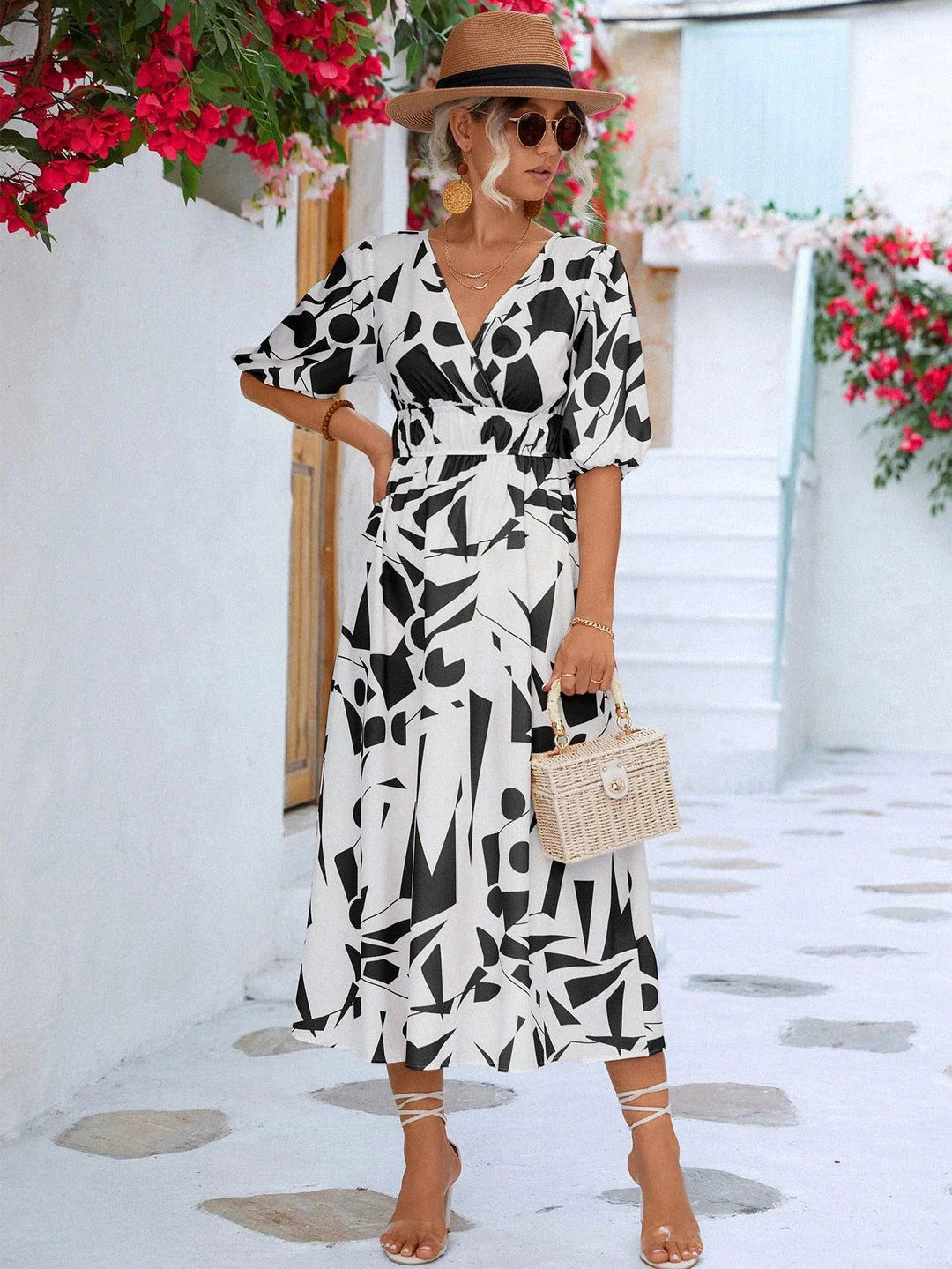 A stylish printed surplice dress with balloon sleeves, perfect for effortless elegance