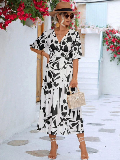 A stylish printed surplice dress with balloon sleeves, perfect for effortless elegance