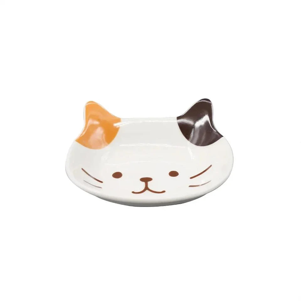 A charming Japanese-style ceramic dish featuring a cute cat design, perfect for serving sauces, dips, and small portions in style.