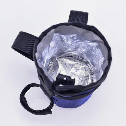 Insulated gray handlebar bag securely holding a 750ml water bottle, designed for easy access to hydration while cycling