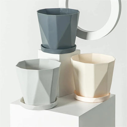 Elegant Nordic-style resin flower pot with a minimalist design, perfect for displaying indoor plants and adding a touch of Scandinavian charm to any room.
