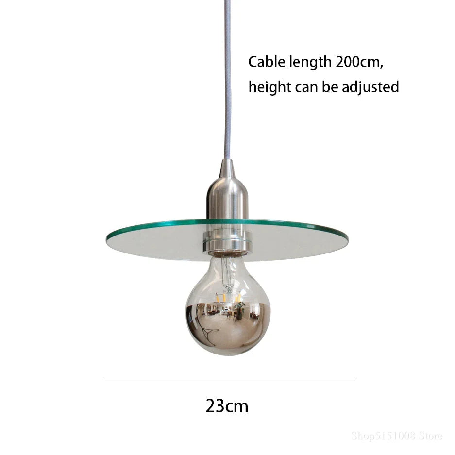 Elegant modern clear glass pendant light with a white shade, perfect for dining rooms and bedrooms