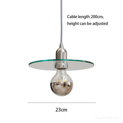 Elegant modern clear glass pendant light with a white shade, perfect for dining rooms and bedrooms
