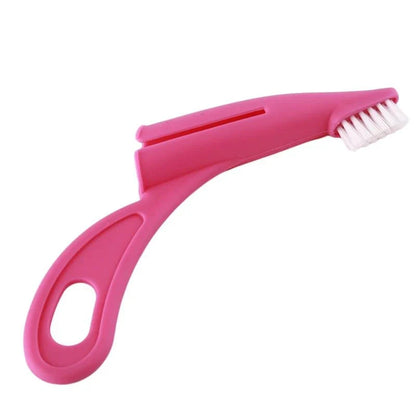 An ergonomic finger toothbrush designed for easy and effective pet dental care, featuring soft bristles and a comfortable grip.