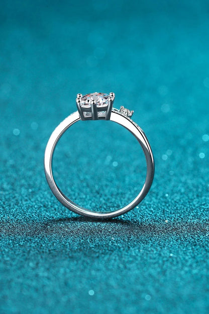 Elegant 925 sterling silver moissanite ring with a dazzling center stone and rhodium-plated finish