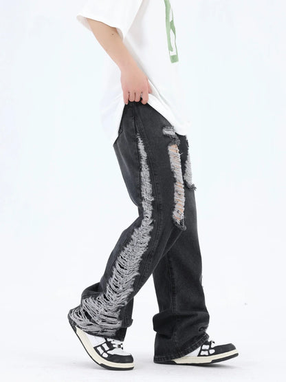 Premium loose fit distressed denim trousers for men and women, featuring a relaxed silhouette, high-quality cotton construction, and trendy distressed details.