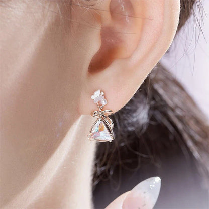 White Shellfish Butterfly Earrings - Elegant sterling silver earrings with natural seashell accents and a captivating geometric butterfly design